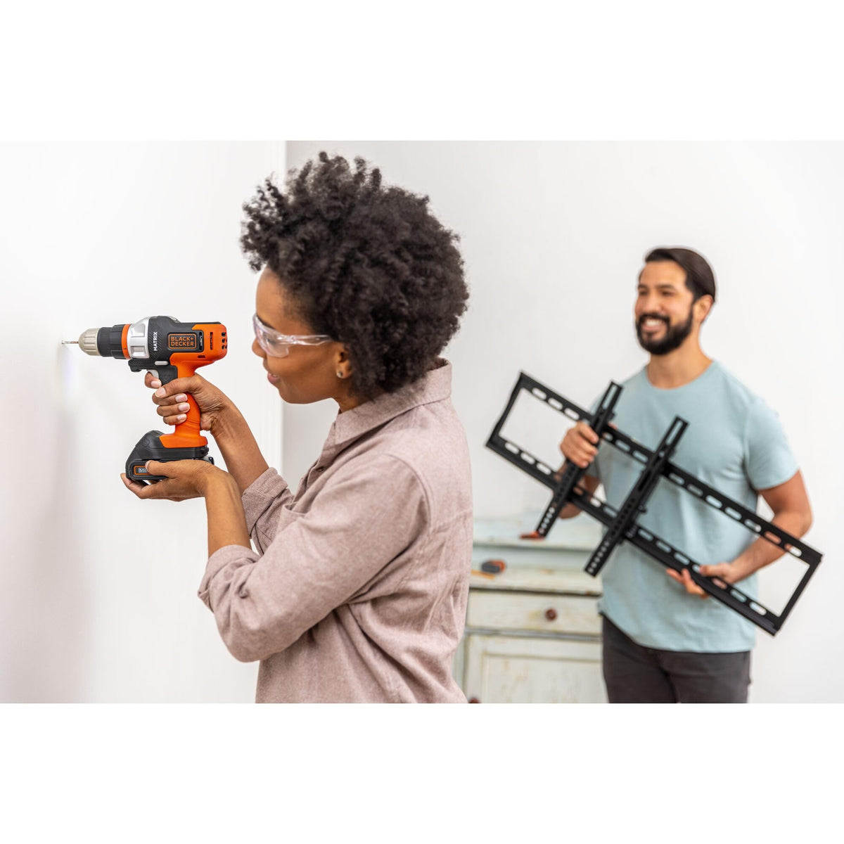 Black+Decker in-use drill/driver completing a home improvement task.