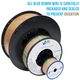 Blue Demon E71T-11 spool positioned for outdoor welding, resists rust and contamination.