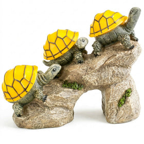 Bo-Toys solar turtles on log illuminate your garden at night with whimsical charm.