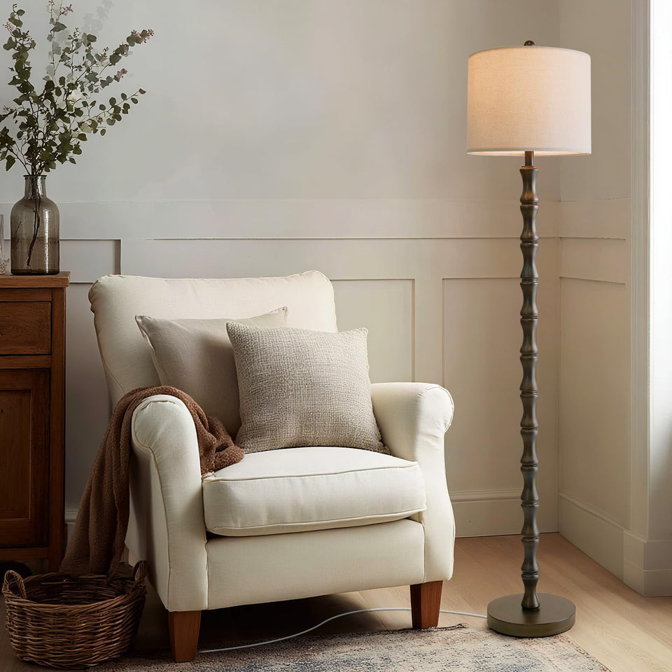 Bobomomo 62-inch rustic floor lamp with base and shade creates a warm living room ambiance.
