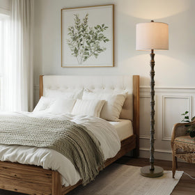 BOBOMOMO lamp shown in a bedroom setup for reading