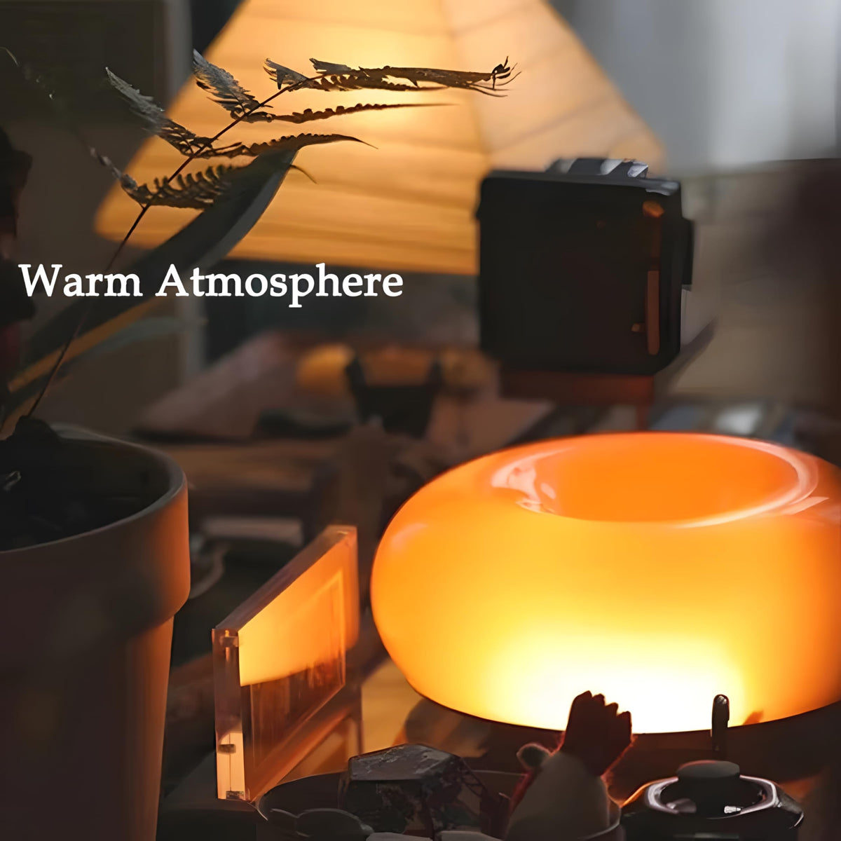 Close-up of Bofea orange donut lamp features a hand-blown glass shade with tiny bubbles.