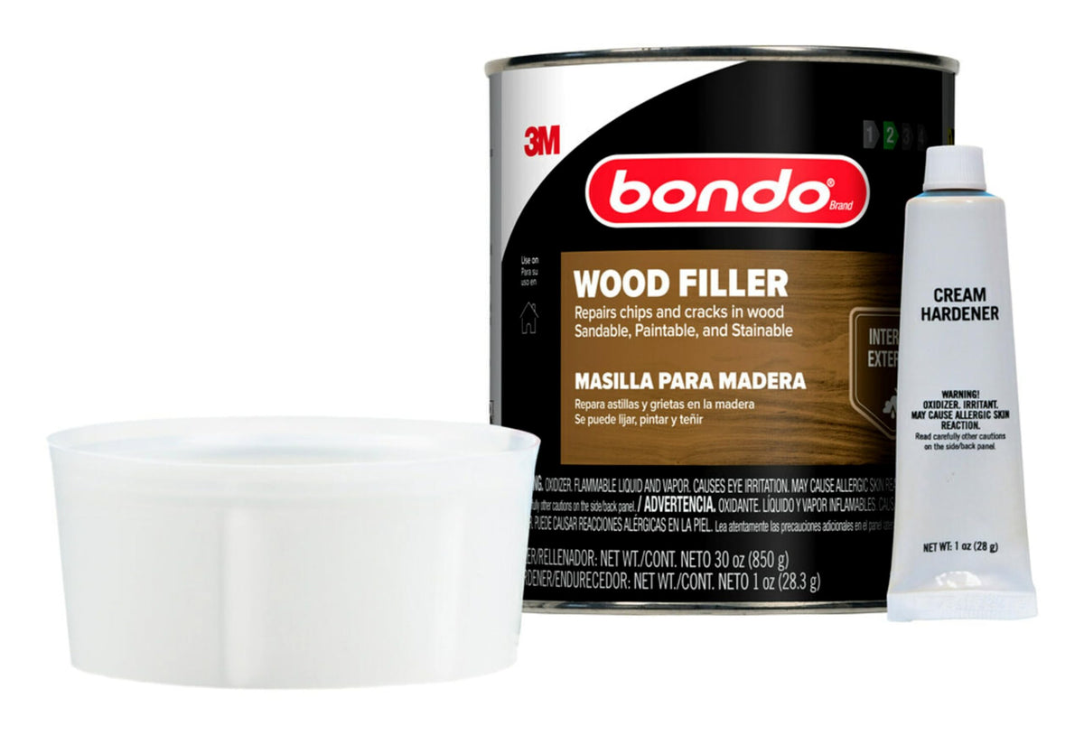 Sanding dried Bondo Wood Filler surface for a smooth finish