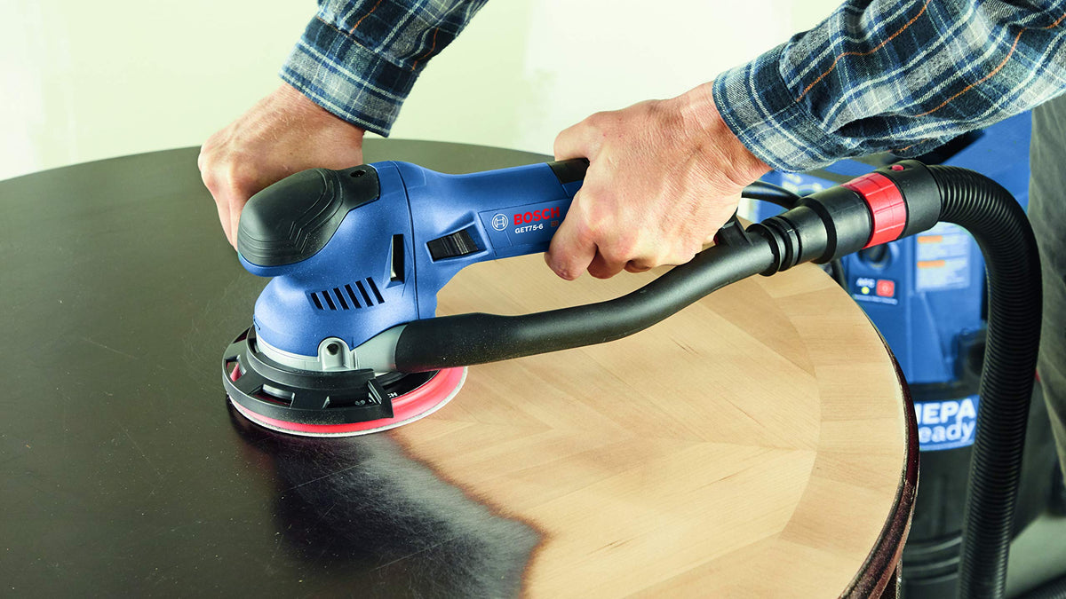 Bosch GET75-6N dust-collection system works with vacuum hoses for cleaner job sites.
