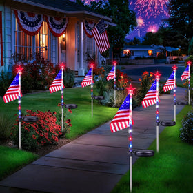 BOSSERN 8-pack American flag solar lights illuminate outdoor spaces at dusk.