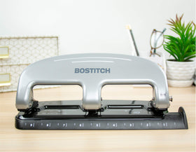 Bostitch EZ Squeeze 3-Hole Punch punching up to 20 sheets efficiently.
