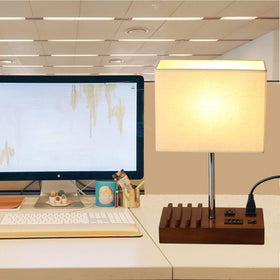 Briever USB table lamp set up in a bedroom for bedside charging.