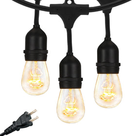 Brightech Ambience Pro 24ft outdoor string lights illuminate a patio with warm Edison glow