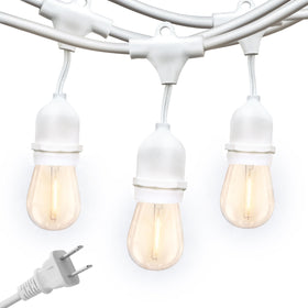 Brightech Ambience Pro outdoor lights hanging above a cozy patio for evenings.
