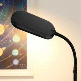 Brightech Litespan Slim in a living room creates a focused reading corner.