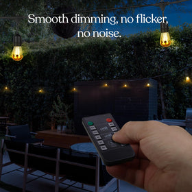 Brightech Dimmer Plug dimmed outdoor string lights create cozy evening ambiance.