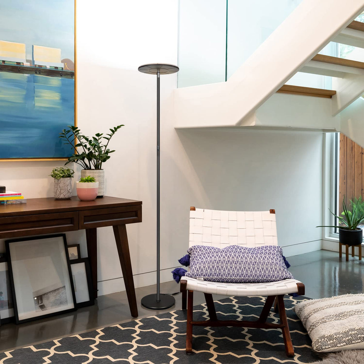 Brightech Sky floor lamp enhances living room ambience for reading and relaxing.