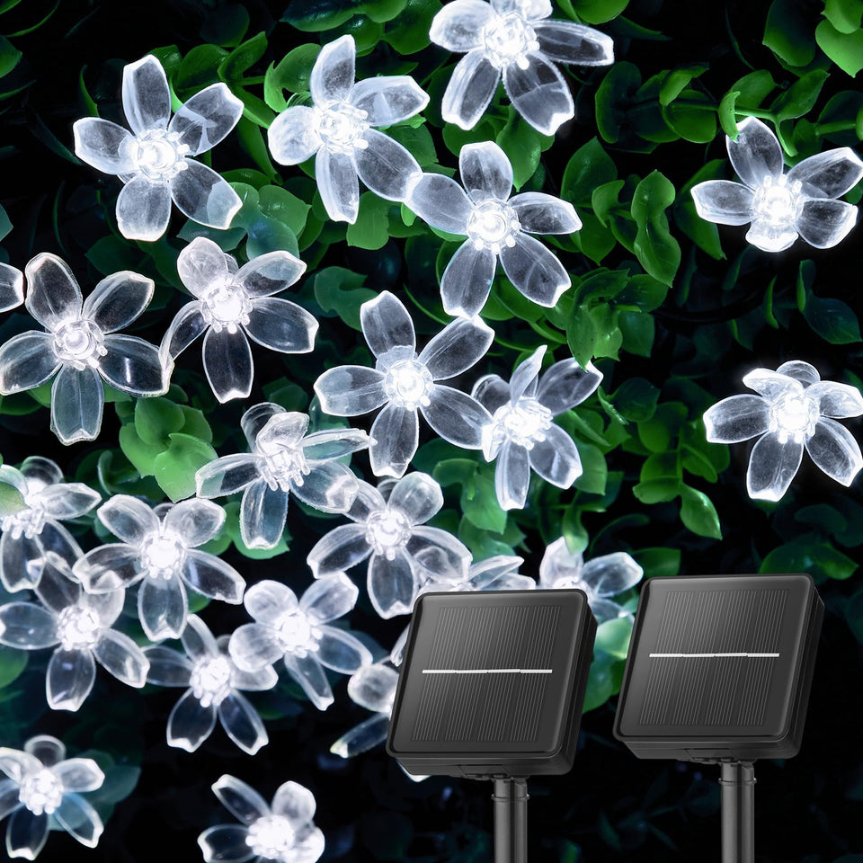 Brightown cherry blossom solar lights illuminate your garden at dusk for magical evenings.