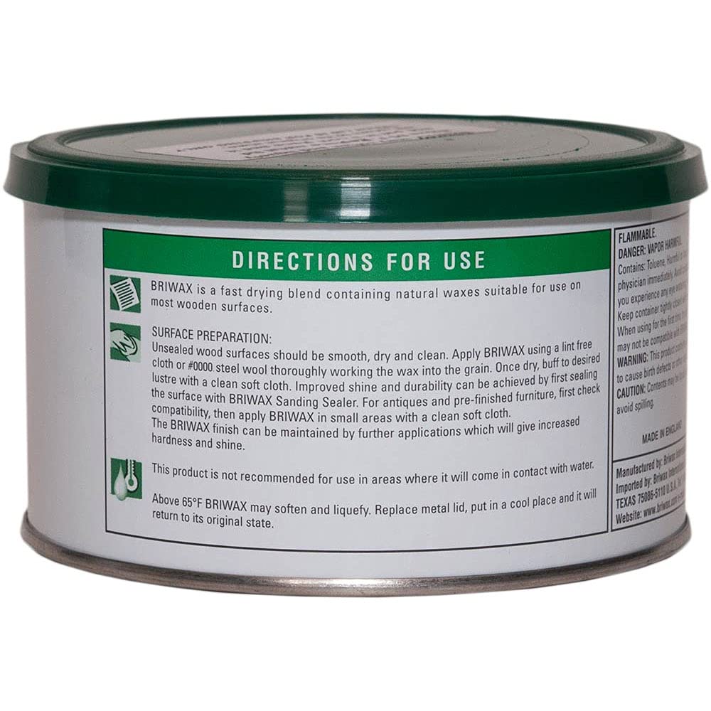 Briwax Dark Brown being applied with a brush for an even finish on furniture.