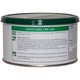 Briwax Dark Brown being applied with a brush for an even finish on furniture.