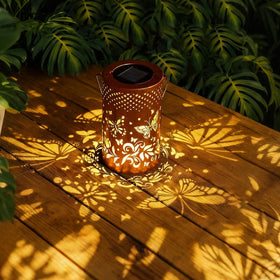 BSGlobal butterfly-pattern cutouts cast delicate garden shadows at night