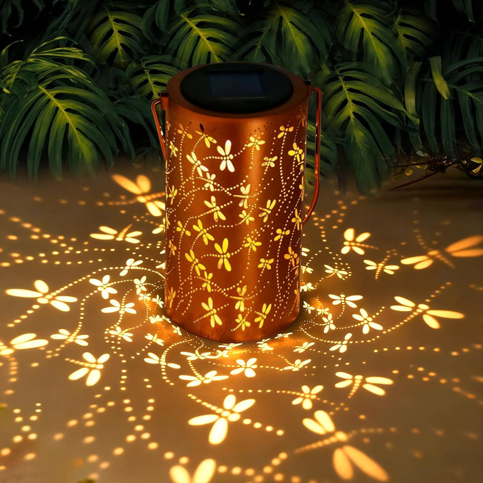 BSGlobal Dragonfly Solar Lantern hanging from a tree, casting delicate patterns for cozy outdoor ambiance.