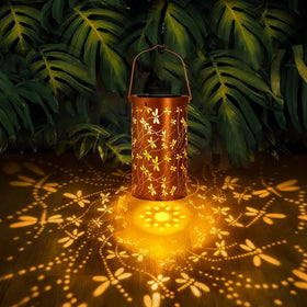 BSGlobal Dragonfly Solar Lantern on a patio table, warm glow for evenings outdoors.