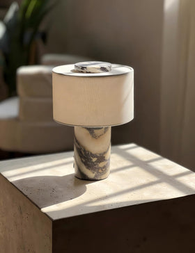 BSOD marble lamp shade closeup, soft glow enhancing cozy bedside ambience.