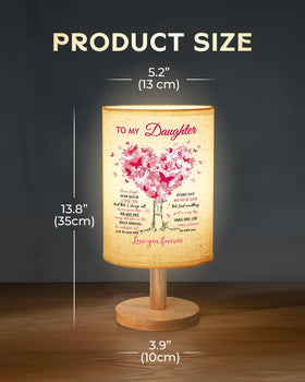 Calibron lamp features USB charging port for easy device power at bedside.