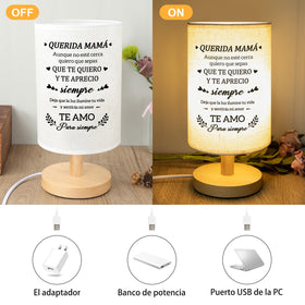 Calibron table lamp enhances bedroom decor with minimalist, tasteful styling.
