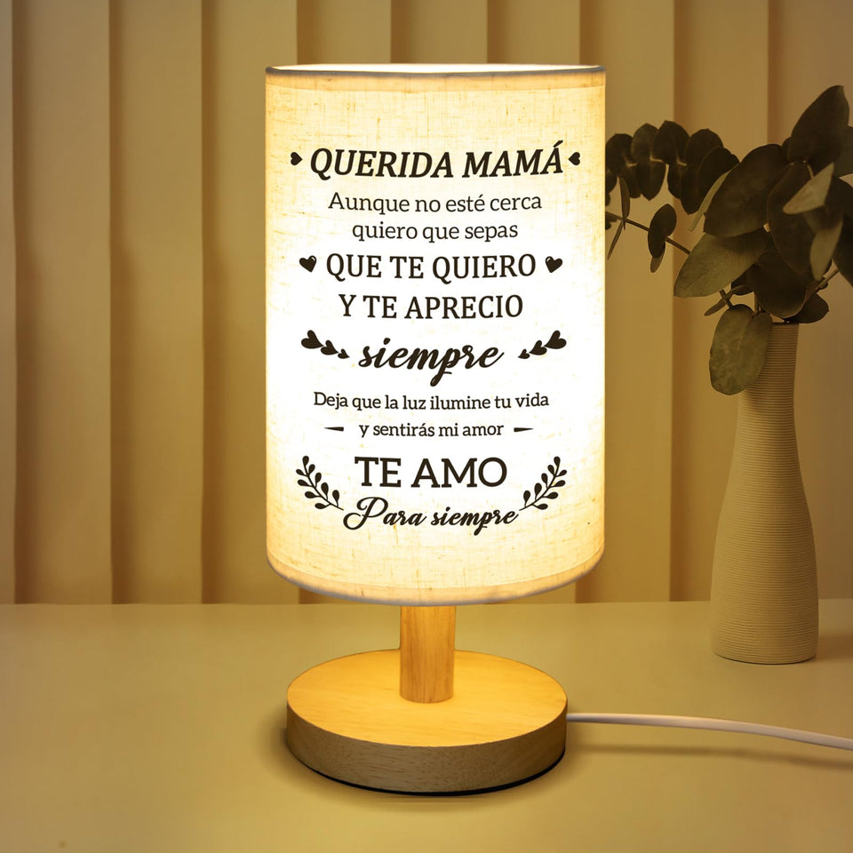 Calibron table lamp with wood base and beige linen shade for a calming bedside glow.