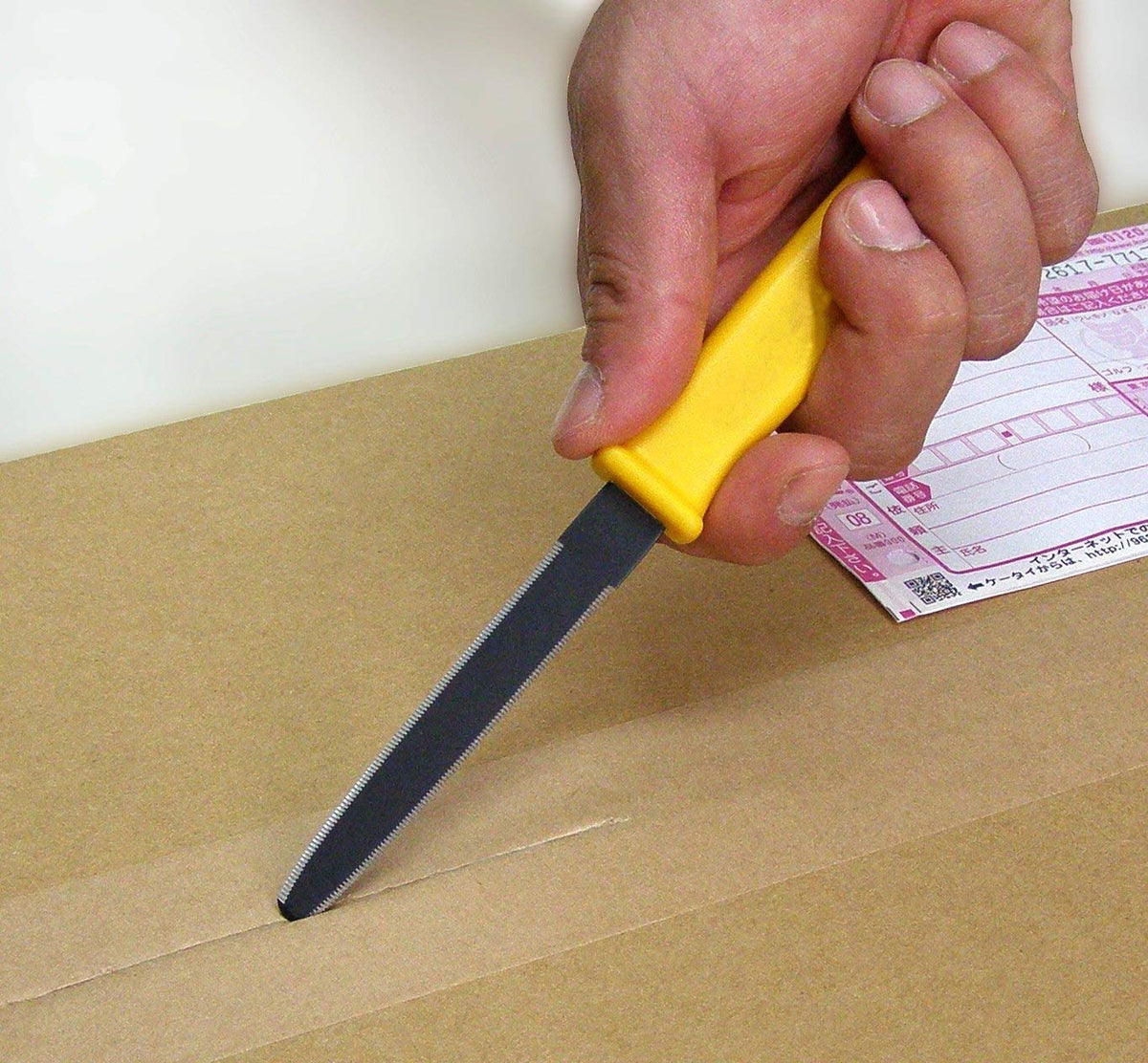 CANARY Cardboard Cutter in use opening a package with ease