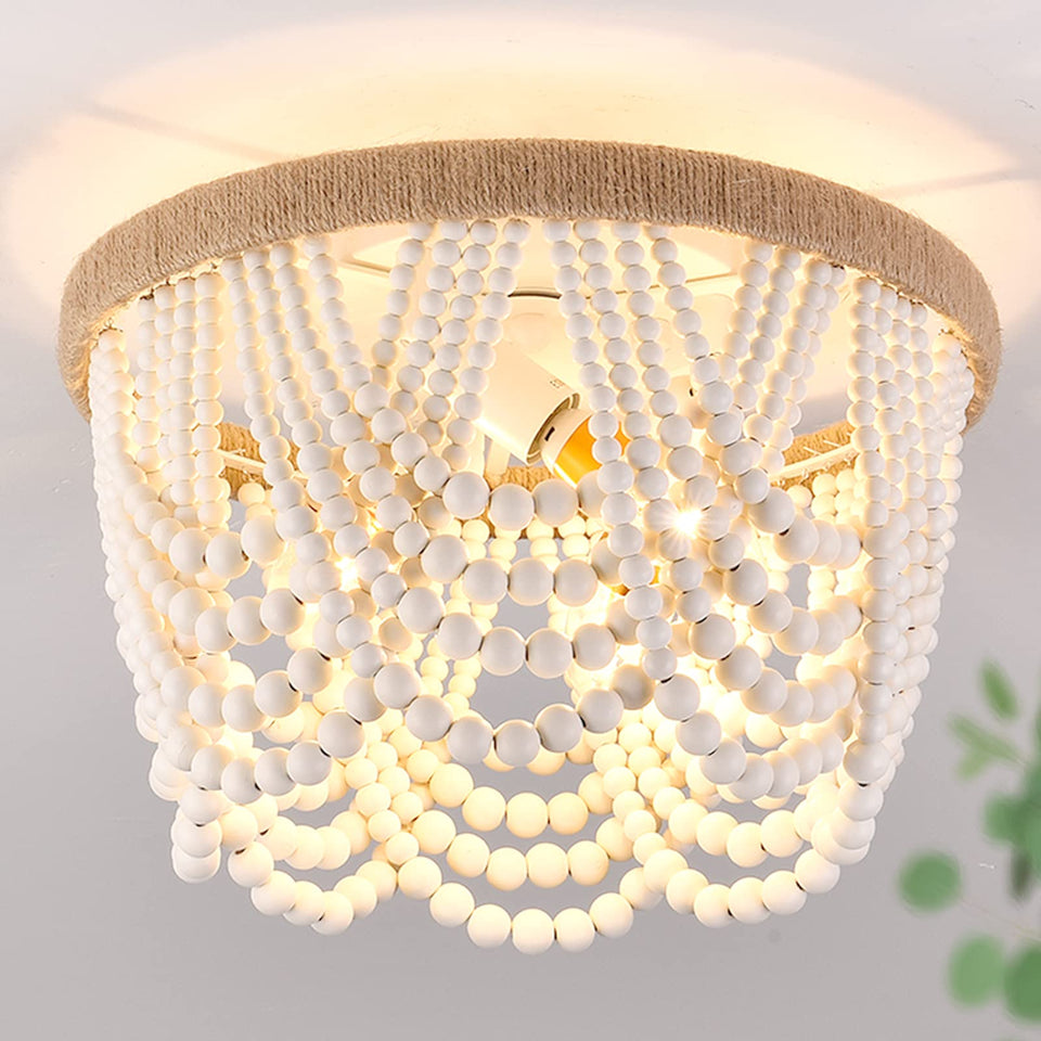 Capslpad wood-beaded flush mount chandelier for ambient dining room lighting.