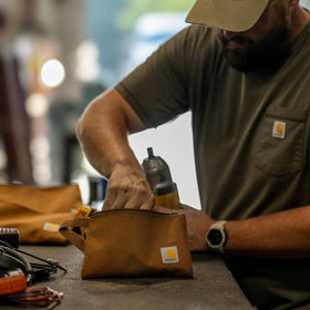 Carhartt pouch integrated carry handle enables one-handed access
