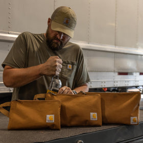 Carhartt durable Rain Defender DWR finish shown in rugged use