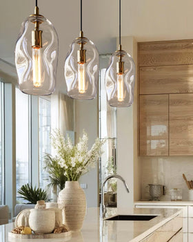 CASAMOTION gold fixture over dining table creates warm ambience.