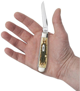 Case XX WR Amber Bone Mini Trapper with Clip and Spey blades ready for outdoor use