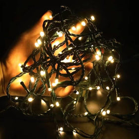 Caseffect 12V outdoor string lights over a 33ft setup with 100 warm white LEDs for ambient glow.