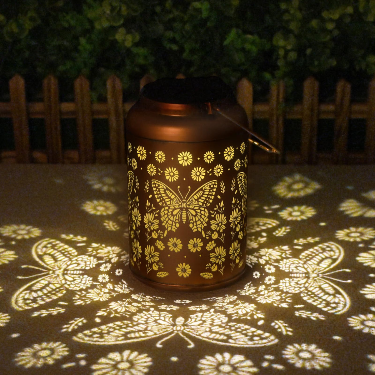 Cawalap butterfly solar lantern in gold glows warmly for garden ambience.