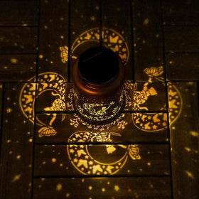 Tabletop display of Cawalap Cat Solar Lantern adding cozy yard décor