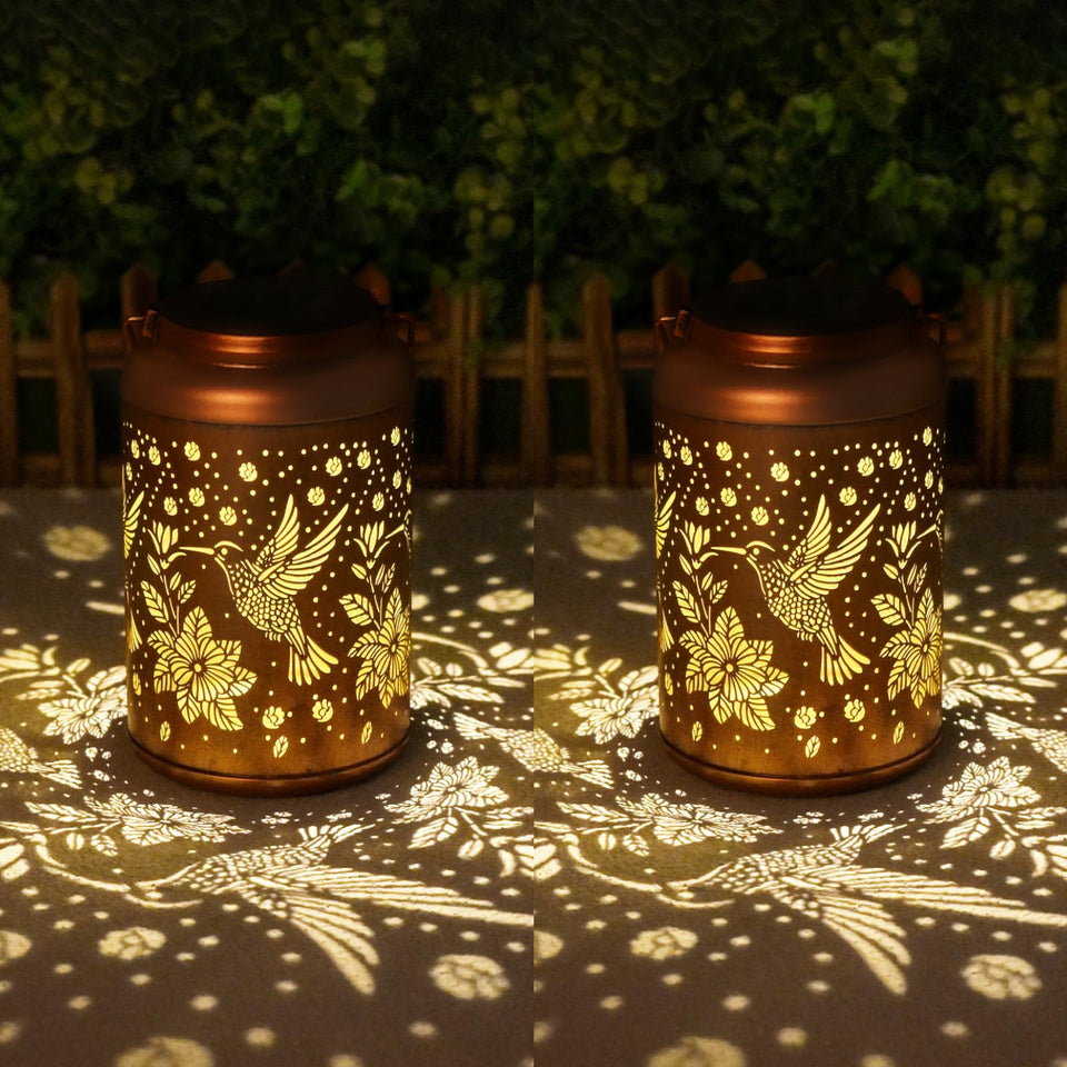 Cawalap hummingbird solar lantern for garden decor provides warm ambient light.