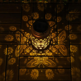 Cawalap table-top butterfly lantern creates intimate garden moments after dusk.