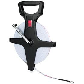 Champion Sports open reel measuring tape with metal spike stabilizes readings on dirt.