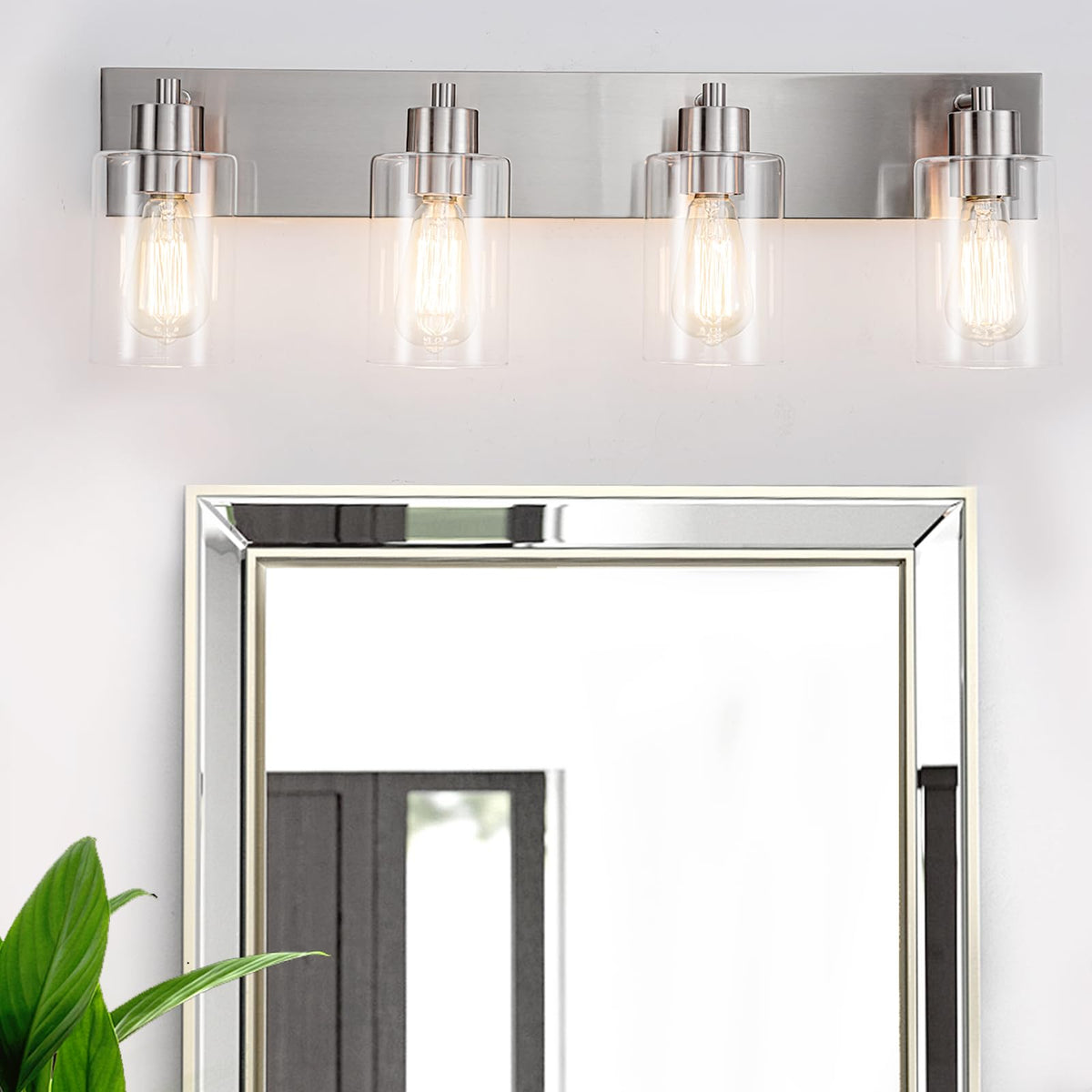 Chosenior 4-light vanity light with brushed nickel finish and clear glass illuminates bathrooms