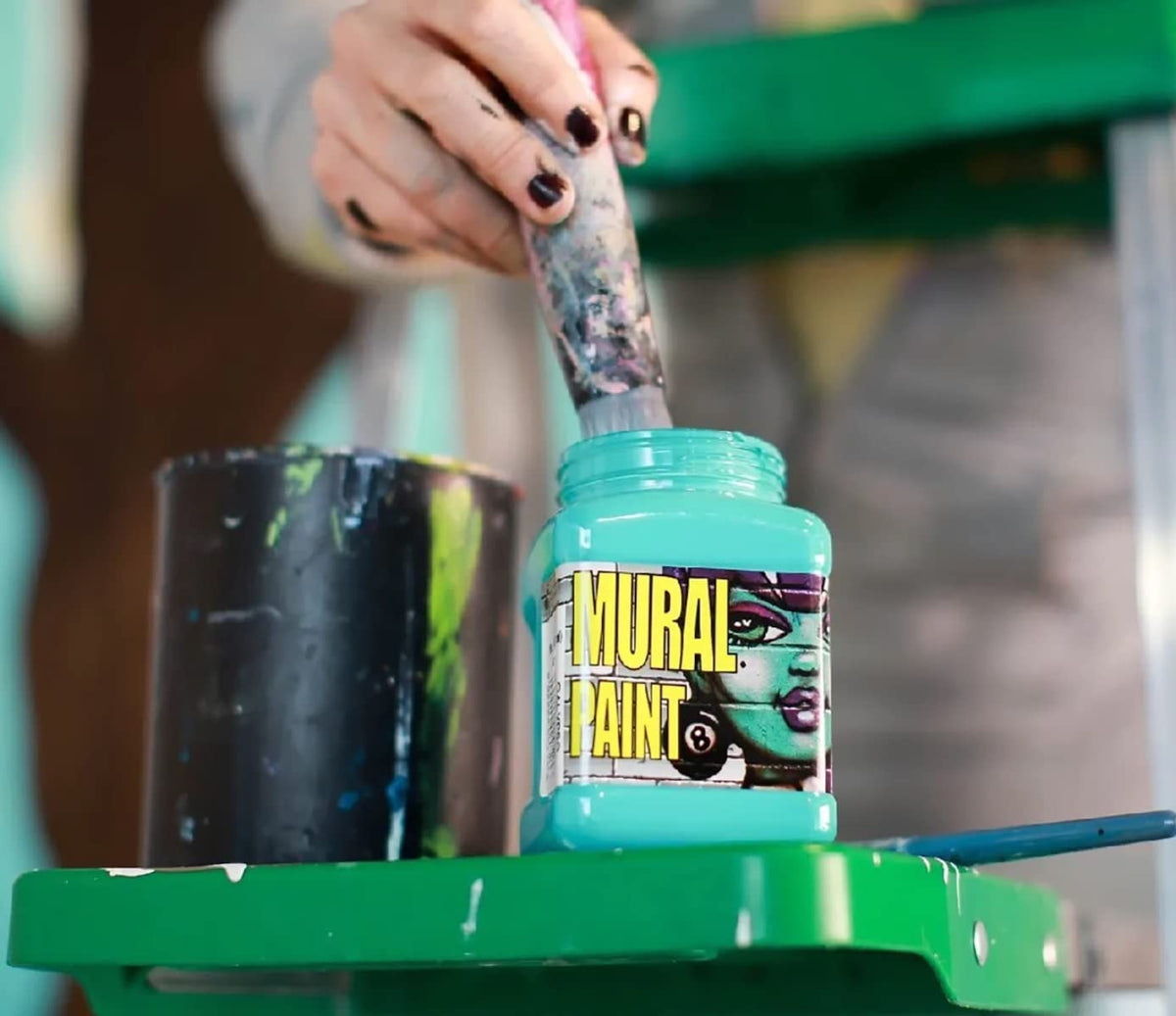 Chroma Mural Paint pots closeup showing vibrant pigments for outdoor projects