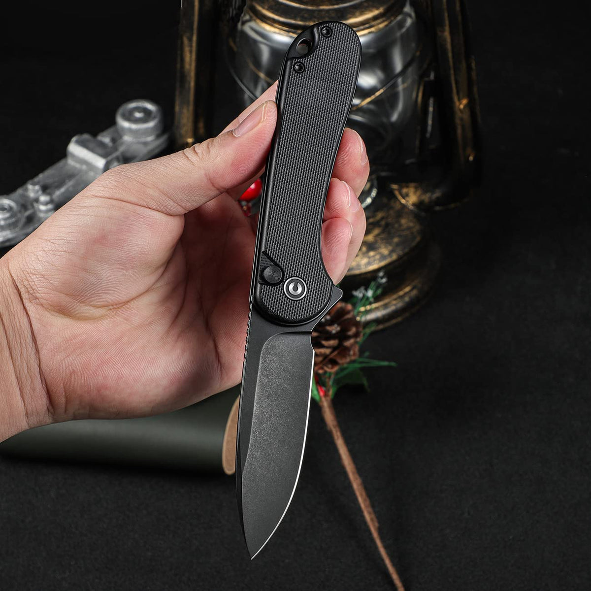 Close-up of CIVIVI Elementum II handle detail showing G10 grip.