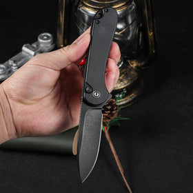 Close-up of CIVIVI Elementum II handle detail showing G10 grip.