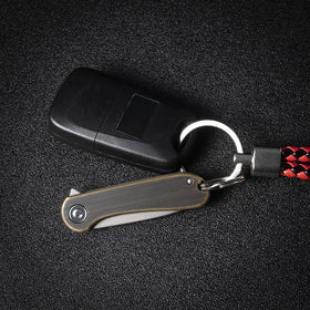 CIVIVI Mini Elementum brass handle offers stylish grip and balance.