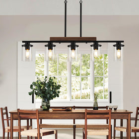 CmnVmn five-light chandelier with clear glass shade brightens kitchen island