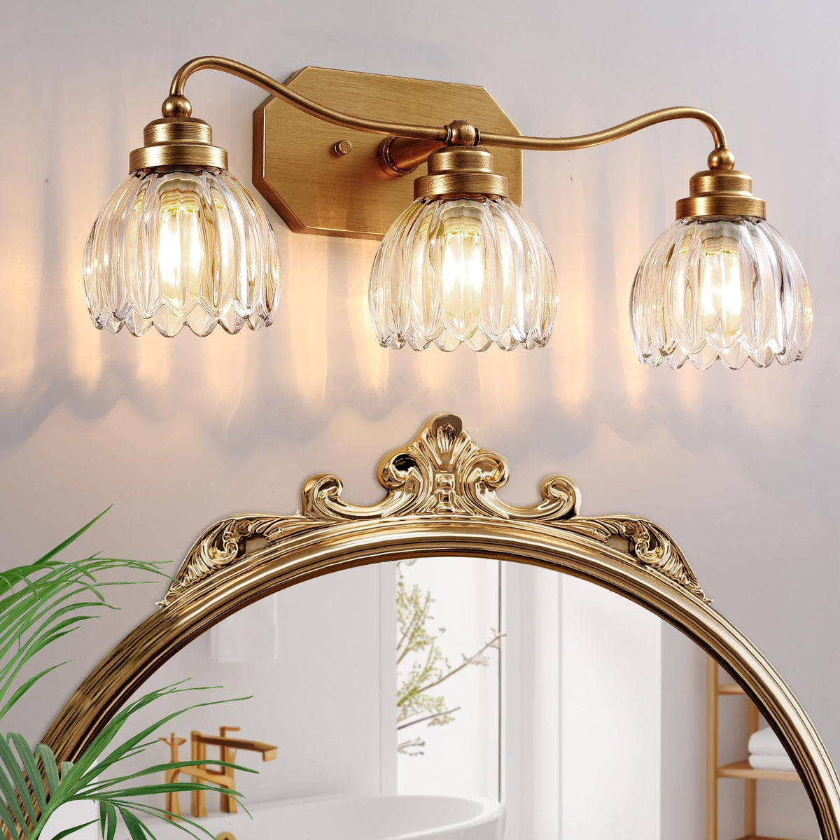 CmnVmn vintage bathroom light 3-light gold with crystal shade enhances ambiance.