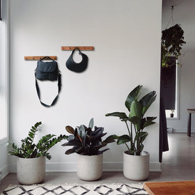 Cobnap entryway organizer displaying coats, bags and towels in a compact space
