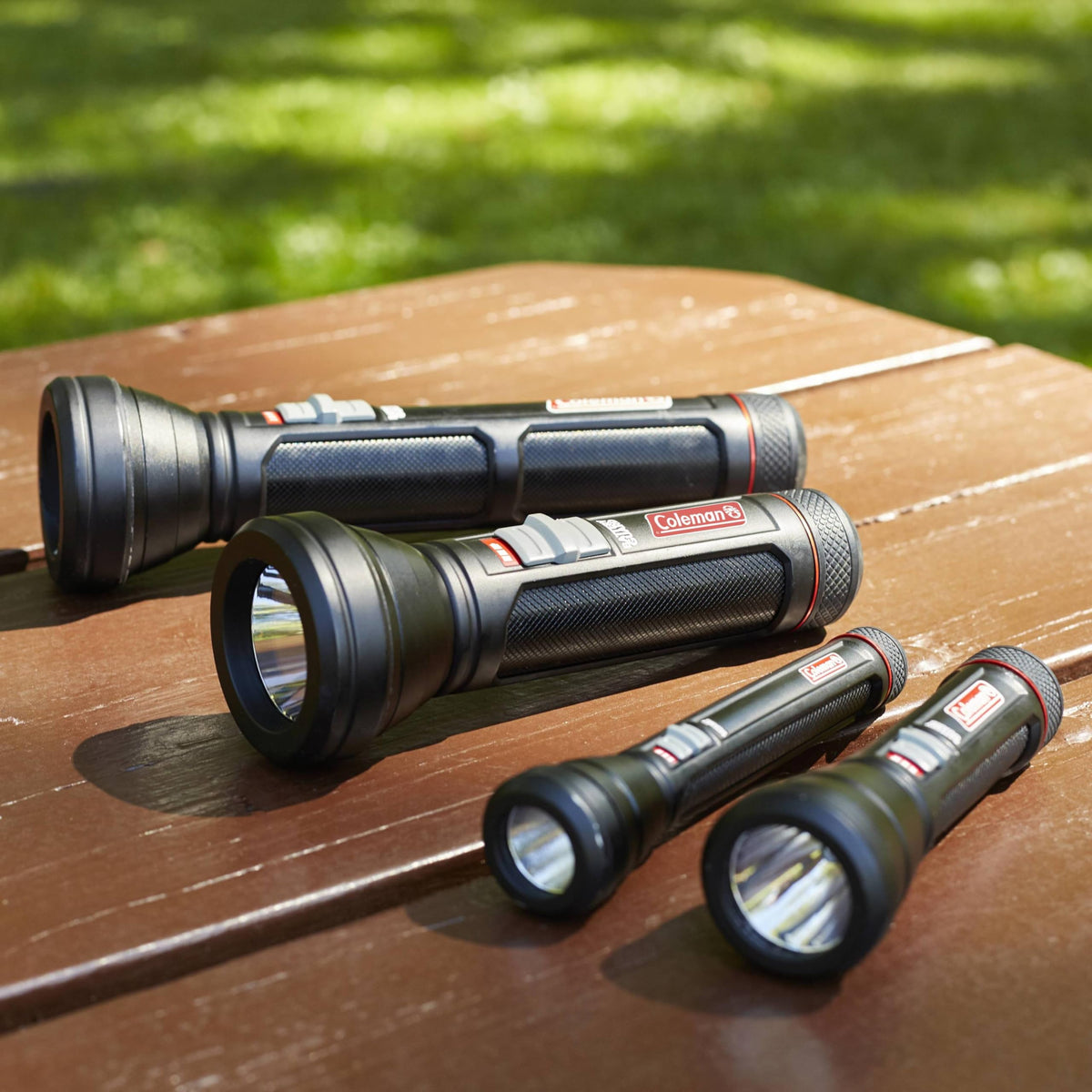 Coleman Battery Guard 250m LED Flashlight durable rubber-edged bezel protects drops.