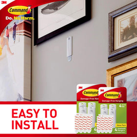 Command 8 white picture frame hangers pair with 16 strips.