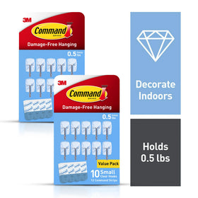 Close-up of Command hooks installed with damage-free adhesive on a smooth surface