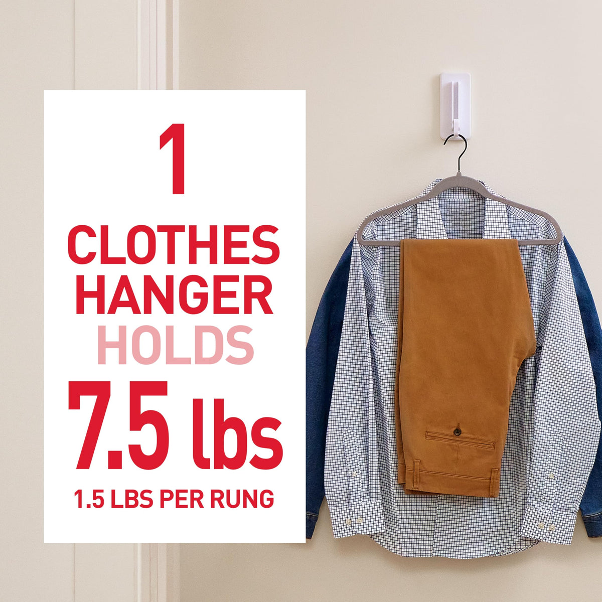 Command folding clothes hanger folded-flat on wall to minimize footprint.